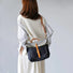 Model carrying a Denim Trimmed Messenger Bag as crossbody, easy for commuting and weekends.