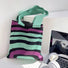 Close-up of Arc Line Knitted Bag in green and purple, ideal for errands and gifting.