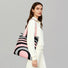 Model carrying a pink and grey Arc Line Knitted Bag on shoulder, great for daily carry and travel.