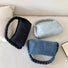 Bolso de mano de mezclilla con asa trenzada