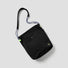 Front view of the black bag, which folds easily into a small pouch for storage.