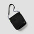 Front view of the black bag, which folds easily into a small pouch for storage.