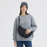 Model wearing a black Casually Knotted Nylon Crescent Sling Bag, perfect for an urban commute.