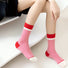 Model wearing a pair of pink bold clash socks, easy for travel days and daily comfort.