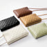 Front view of Five woven PU leather crossbody bags in black, white, brown, tan, and light green crossbody bag Braid.