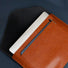 Close-up of brown Buttoned Leather File Folder, great for everyday carry and travel.
