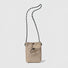 Flat lay of a mini Casual Lite Mini Bag in khaki, great for everyday carry and travel.