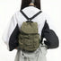 Back view of model with olive pleated backpack; ergonomic design ideal for comfortable daily commuting.