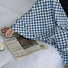Angled view of Checkerboard Bath Towel with blue and white checkered pattern.