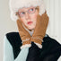 Close-up chestnut suede split-finger gloves with knit cuff and stitching; cozy for cold-weather wear.