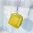 Yellow Chroma mesh pouch with lanyard strap, hanging shot; lightweight zip organizer for keys or mini toiletries.
