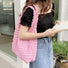 Model carrying the pink Cloud Puff Tote Bag on her shoulder.