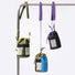 3 colors of mini bucket bags hanging on rack. Adjustable straps. Versatile outdoor style.
