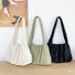 Three concise pleated shoulder bags in white, green, and black; affordable minimalist nylon totes under $50.