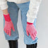Close-up contrast striped knit gloves with ribbed cuff; cozy warmth for cold-day outfits.