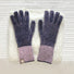 Purple contrast striped knit gloves with ribbed cuffs; cozy accessory for winter outfits.
