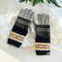 Convertible Fair Isle knit cuff gloves in navy/grey with tan pattern, layered over grey gloves; cozy winter wear.
