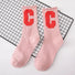Folded view of Cool C Socks in pink, ideal for workouts and commuting.