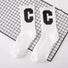 Angled view of Cool C Socks in white, great for daily wear and lounging.