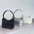 Three cool patent leather shoulder bags in black, silver, and white, featuring a sleek, compact design.