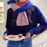 Model wearing Cozy wool-acrylic splicing color scarf in blue, orange, and pink, worn with a navy sweater.