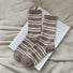 Folded view of Cozy Wool Striped Socks in camel, ideal for workouts and commuting.