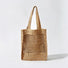 Front view of natural khaki crochet straw tote bag, boho vacation style.