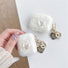 Model Hands holding a Crystal Shell AirPods Case Cover, great for daily use and protection.