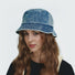 Detailed view of Denim Patchwork Bucket Hat showcasing rugged textured denim and unique patchwork panels.