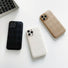 Collection of diamond pattern PU leather cases in black, white, and gold. Elegant sophisticated accessories.