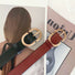 Two PU leather Double C Lady's Belts, one black and one brown, with gold oval buckles.