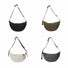 Four nylon crescent crossbody bags in black, olive, cream, and charcoal with adjustable straps and zip-top fastening.