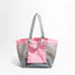 Front view of the soft pink and grey reversible tote bag.