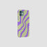 Swirling neon-inspired vortex pattern on a silicone phone case. Futuristic techwear aesthetic accessory.