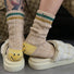 Smiley-Stricksocken mit gestreiftem Oberteil