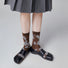 Model wearing a pair of Floral Embroidered Socks in brown, ideal for workouts and commuting.