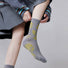 Model wearing a pair of Floral Embroidered Socks in gray, great for daily wear and lounging.