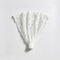 Studio flat lay of the white floral lace headband unfolded into a fan shape displaying the elastic bottom band.
