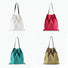 Four foldable canvas pleated shopper bags in white, red, teal, and khaki with dark straps.