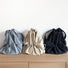 A collection of foldable ultralight waterproof backpacks in blue, beige and black.
