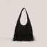 Classic black fringe suede hobo bag with a soft-touch finish and artisanal look.