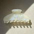 Angled view of Gentle Curve Hair Claw in white moonlight, great for everyday styling and gifting.
