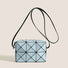 Light blue GeoChic crossbody bag with geometric PU leather design and black adjustable strap.