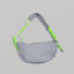 Flat lay of the grey Casually Knotted Crescent Bag featuring a contrasting lime green knotted strap.