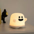 Side view of Halloween Ghost Lamp with smile face on table, great for home decor and gifting.