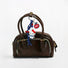Hello Kitty Bag Charm hanging on a handbag, ideal for everyday outfits and street style.