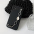 Black silicone case with a silver irregular metal chain wrist strap. Stylish urban techwear accessory.
