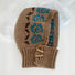 Front view of Jacquard Knitted Balaclava in khaki, knitted from natural wool for a sophisticated outdoor winter look.