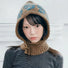 Model wearing Jacquard Knitted Balaclava in khaki, showcasing fine natural wool and detailed jacquard craftsmanship.