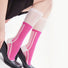 Model wearing a pair of pink knee-high socks, easy for travel days and daily comfort.